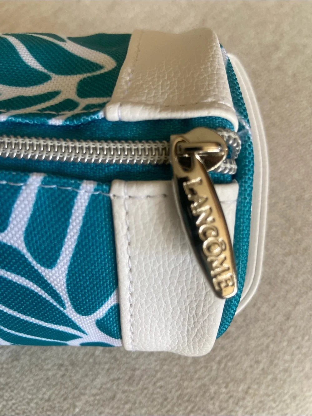 Lancôme Teal and White Floral Tubular Zip Pouch. New, Never used.